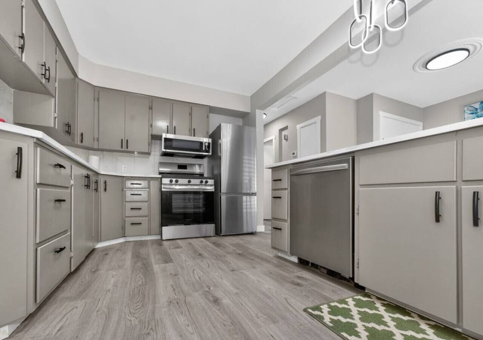 Fully equipped kitchen with ample cabinets and modern appliances for longer stays.