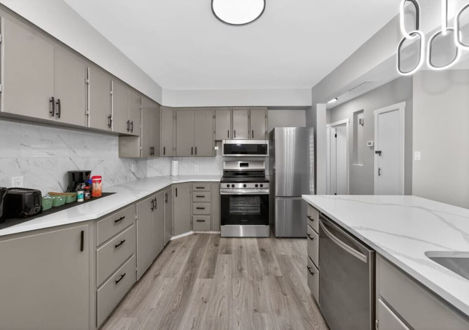 Fully equipped kitchen with ample cabinets and modern appliances for longer stays.