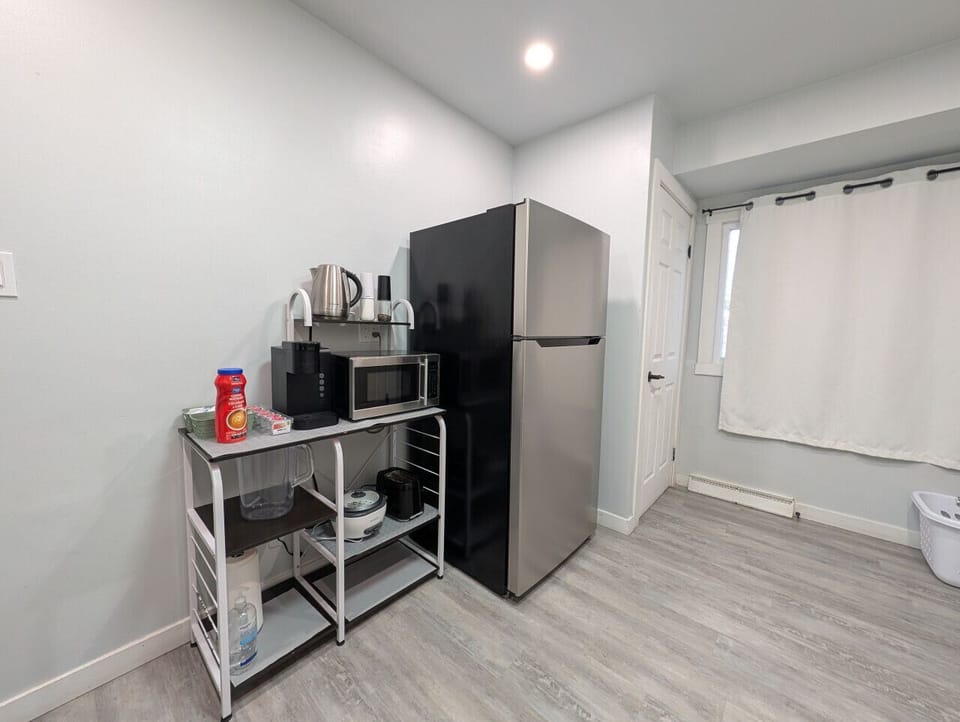 Coffee station and includes microwave, tea, kettle.