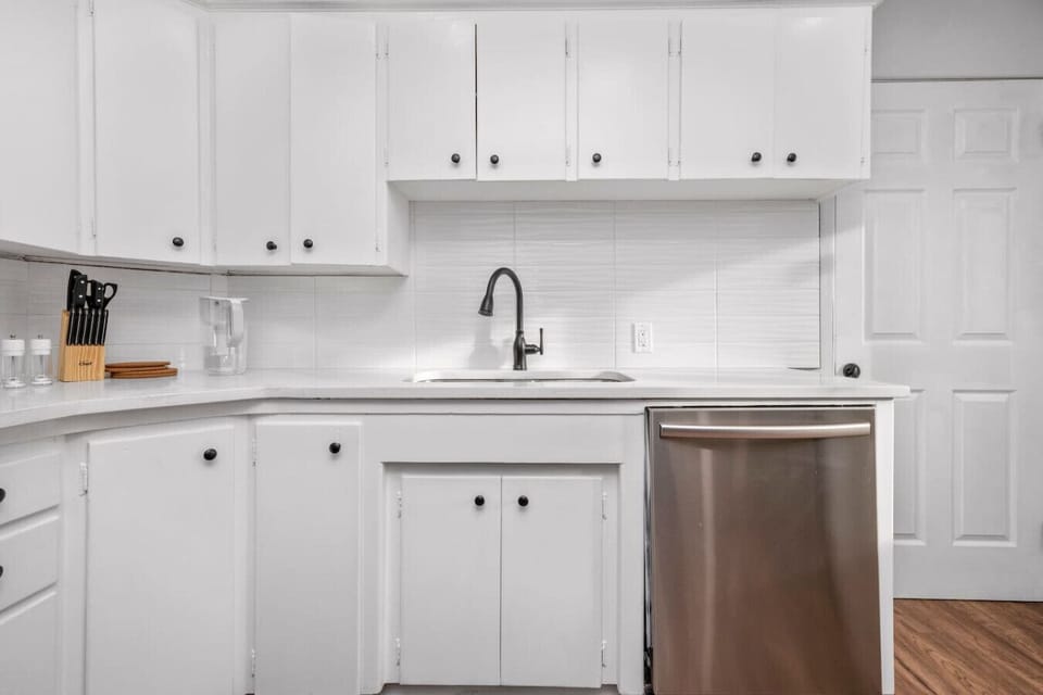 Bright kitchen with ample cabinet space and clean design.