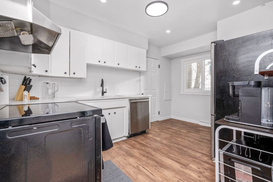 Modern kitchen with full-size appliances and ample counter space.