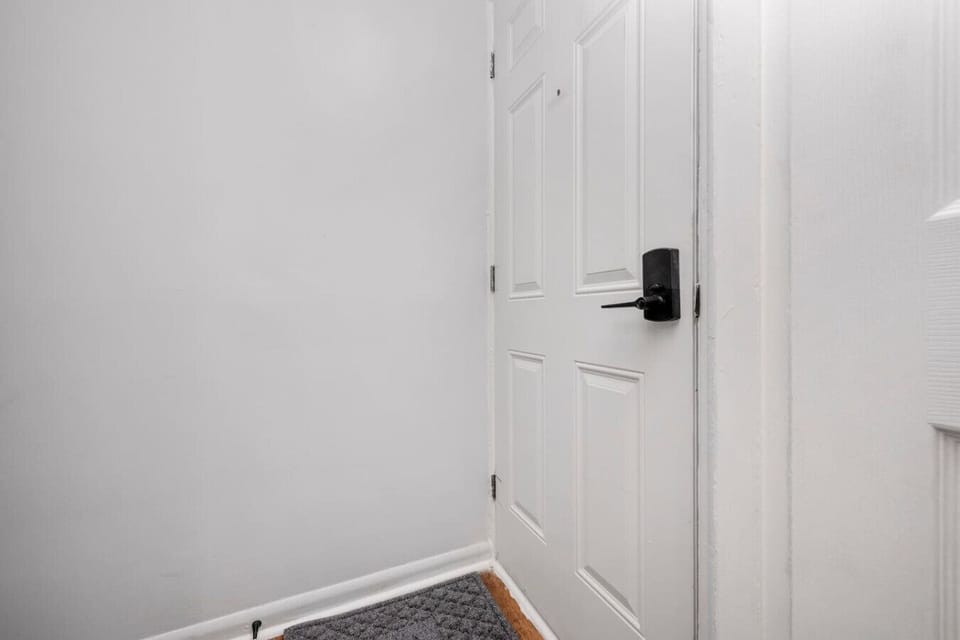 Private entrance with secure smart lock access.