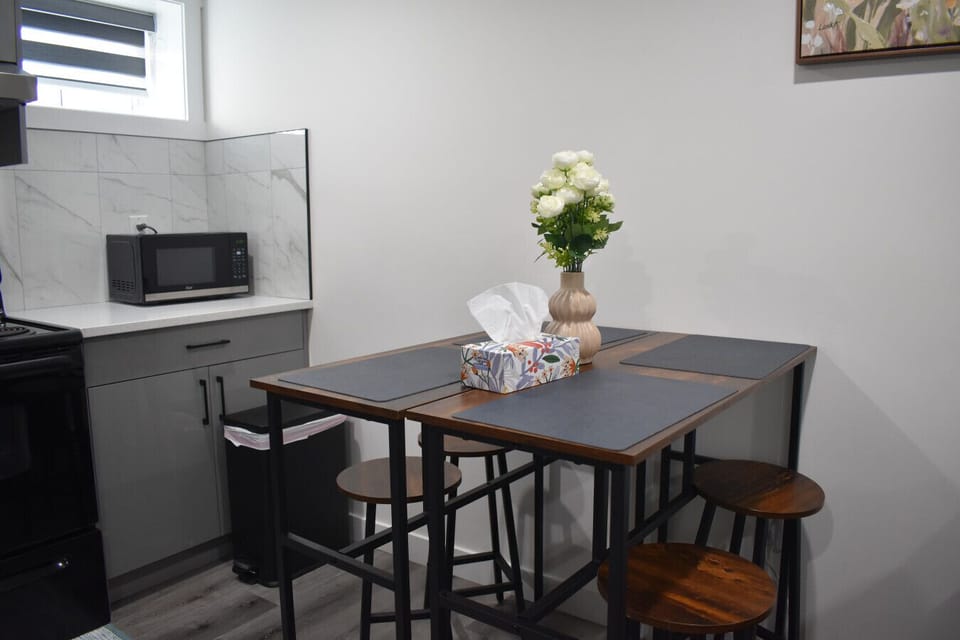 Dining area with seating and open living space