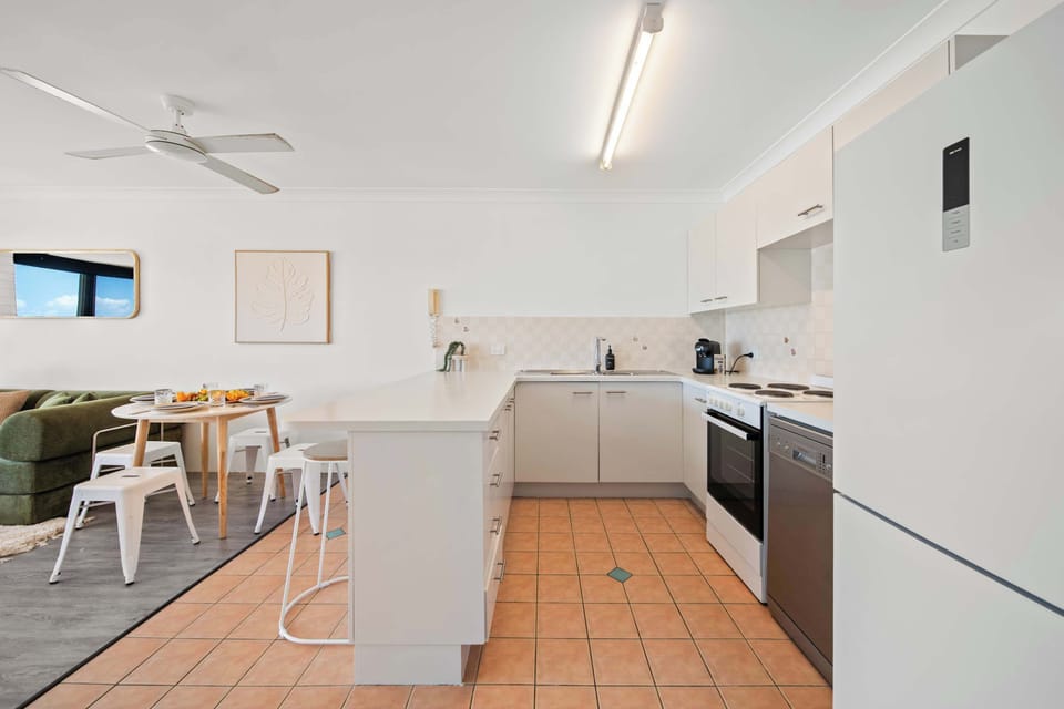 Kitchen flowing seamlessly into living space