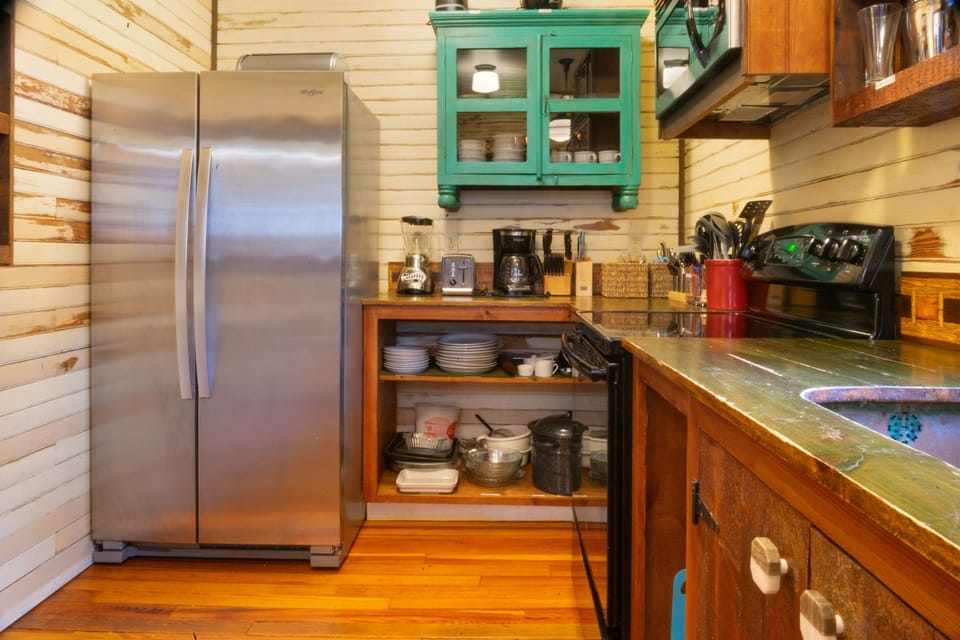 Our kitchen is designed for easy mornings with a dedicated coffee station, toaster, and blender. With a full-sized fridge and ample counter space, it’s the perfect hub for prepping trail snacks or a group breakfast before Acadia.