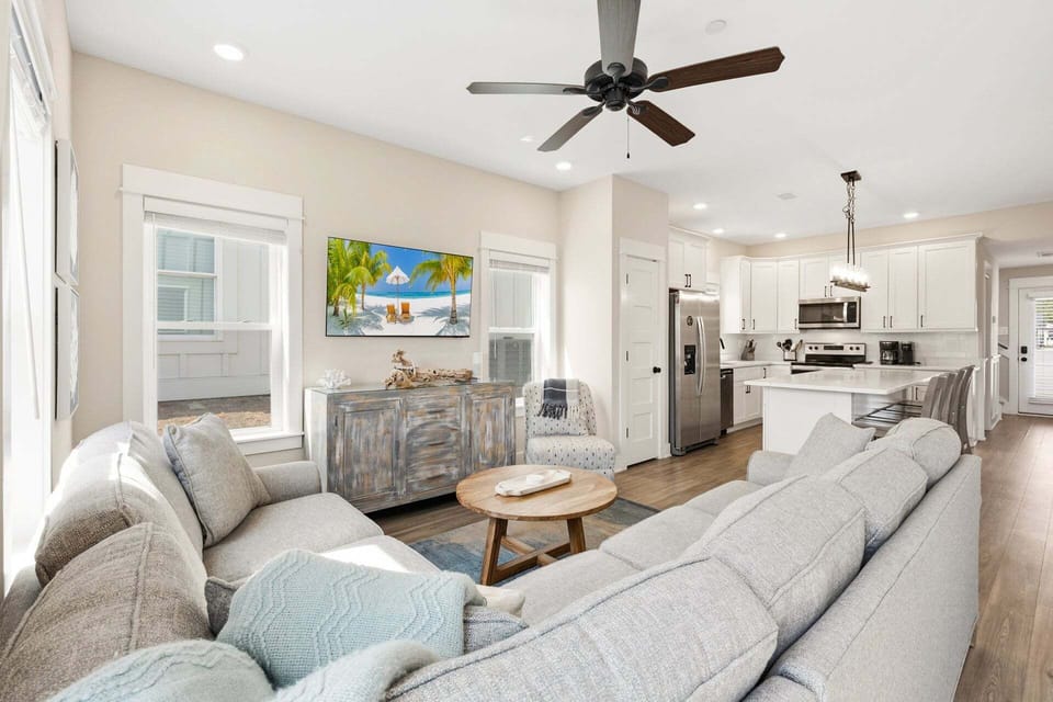 Open-Concept Living Area: Gather together for TV, games, or casual conversation in a spacious, sunlit setting.