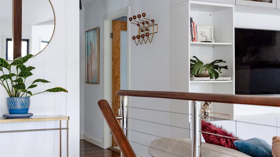 Light-filled hallway connecting the living spaces with a clean and airy design.