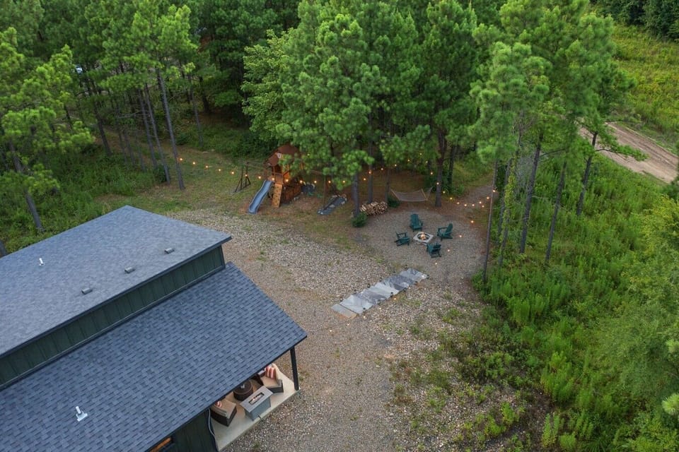 Overhead view of the cabin, playset, and outdoor gathering areas.