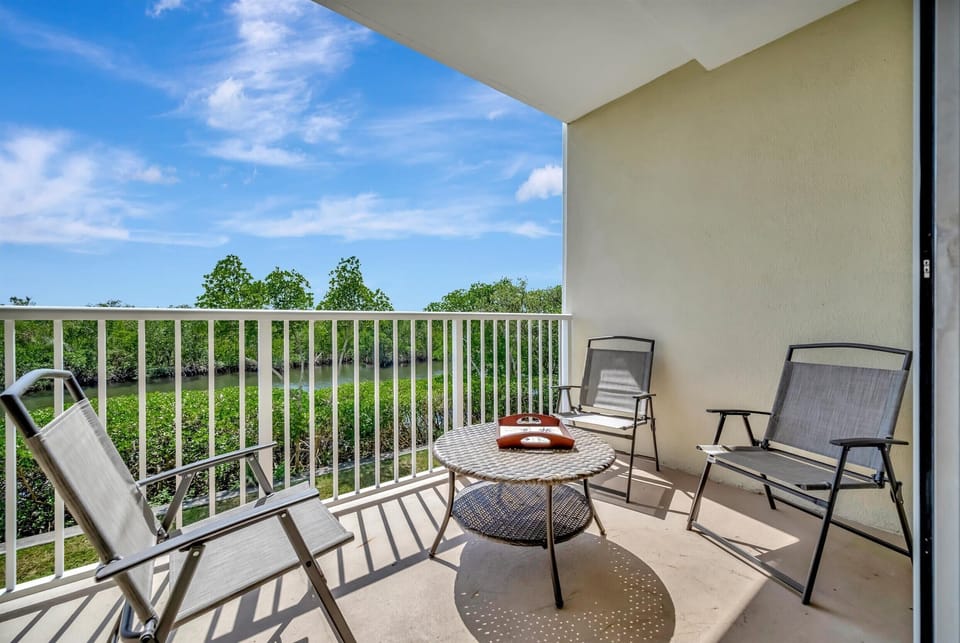 Private balcony with seating overlooking the mangroves