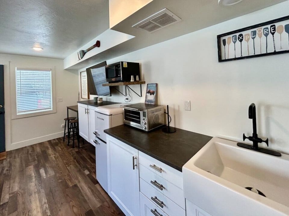 Kitchen area, including a minifridge and toaster oven. 