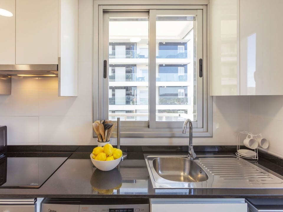 Kitchen, Countertop, Kitchen Appliance, Cabinetry, Major Appliance, Interior Design, Kitchen Sink, Kitchen Stove, Furniture, Wood