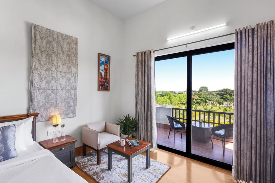 Deluxe Villa, Balcony, Garden View | Living area | Flat-screen TV