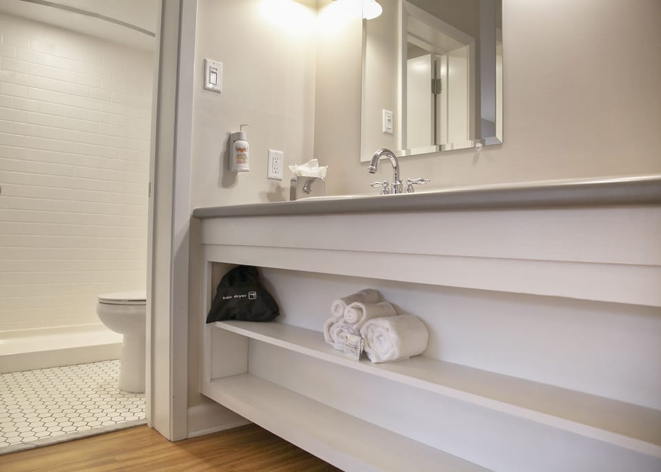 Shower, designer toiletries, hair dryer (on request), towels