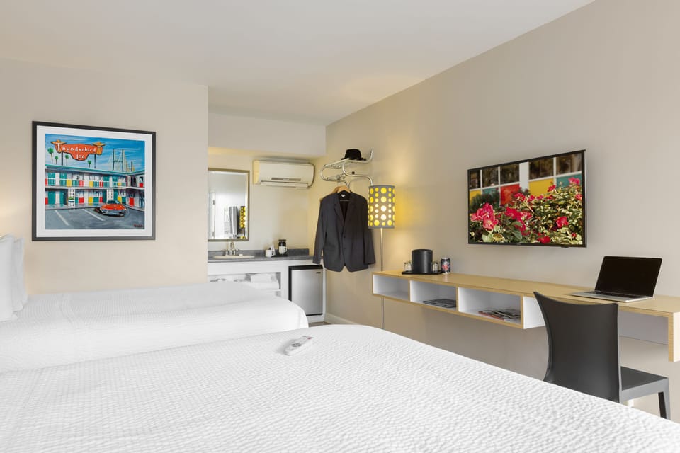 Premium bedding, pillowtop beds, desk, laptop workspace