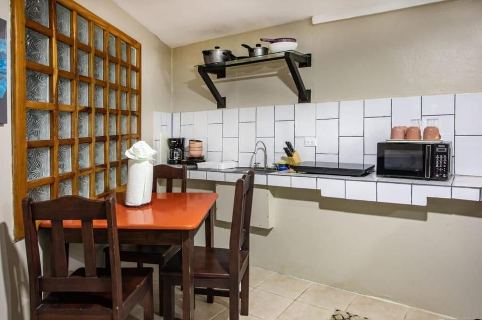 Family Quadruple Room, Patio, Garden View | Dining