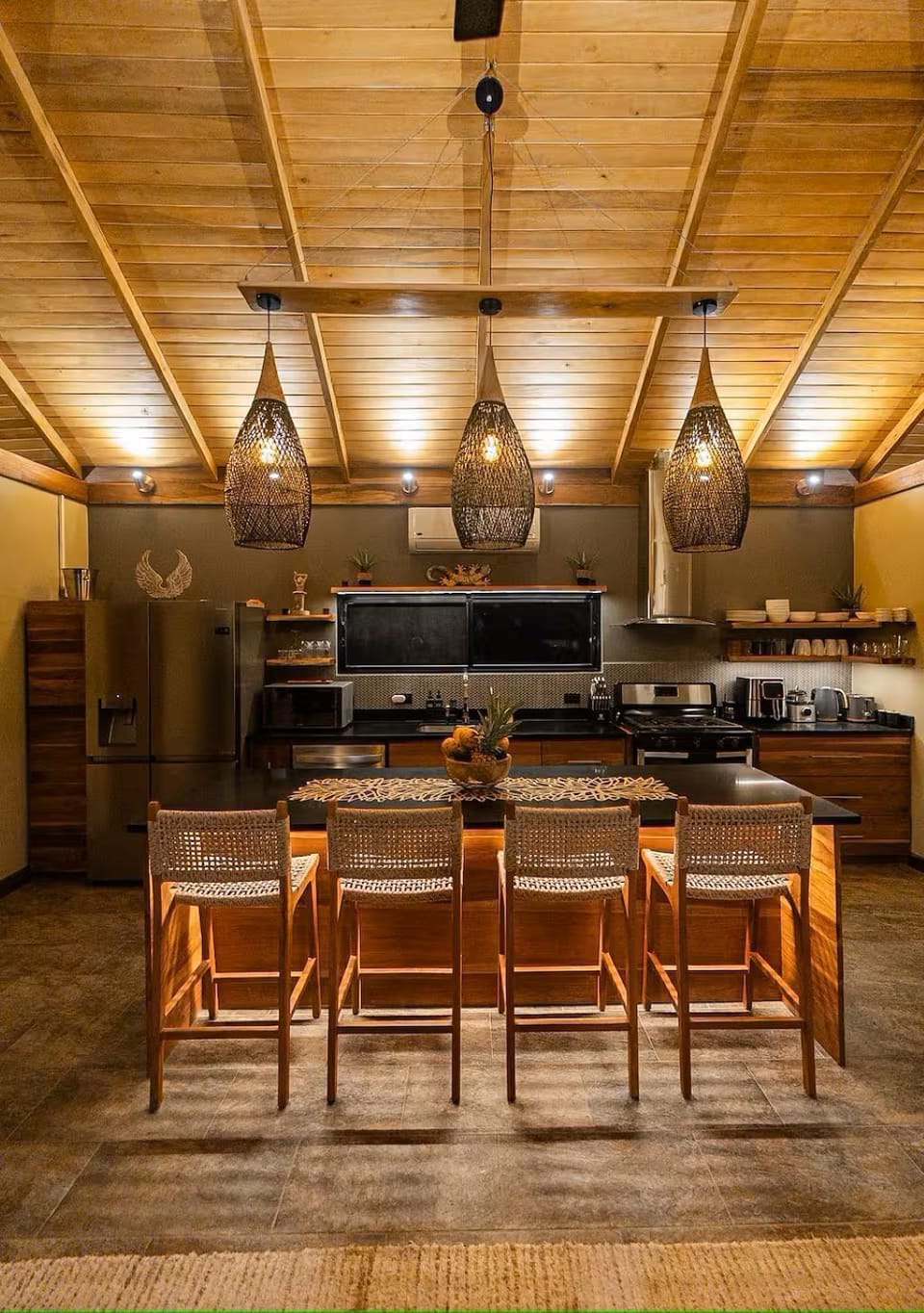 Fully stocked kitchen and a kitchen island that sits 8. Airconditioned room