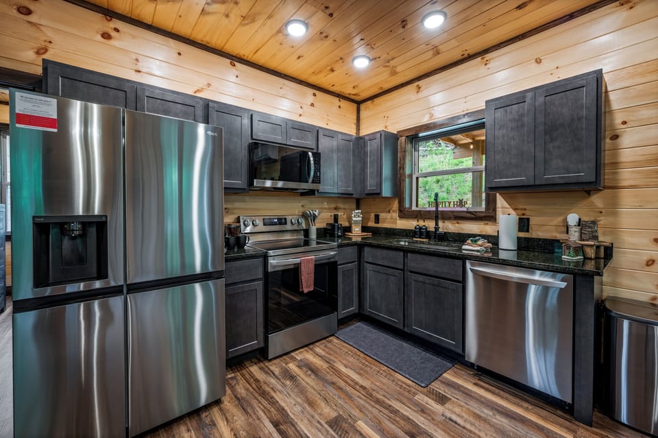 Fully equipped kitchen with appliances, cookware, and dining essentials included.