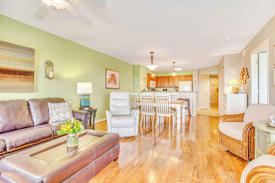 Relax in your spacious open-plan haven with gleaming hardwood floors, leather seating, and a fully equipped kitchen for memorable meals.