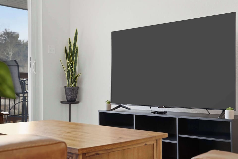 Curl up in the serene living room & stream your favorites on the smart TV​