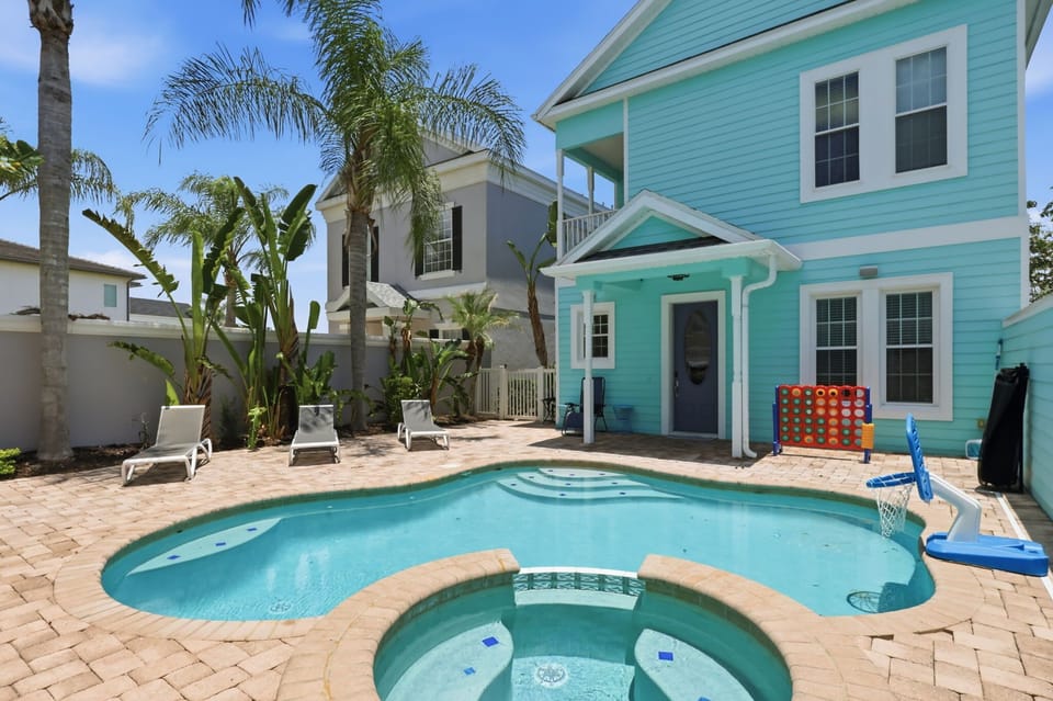 A spacious pool deck with plenty of room to swim, soak, lounge, and make memories together.