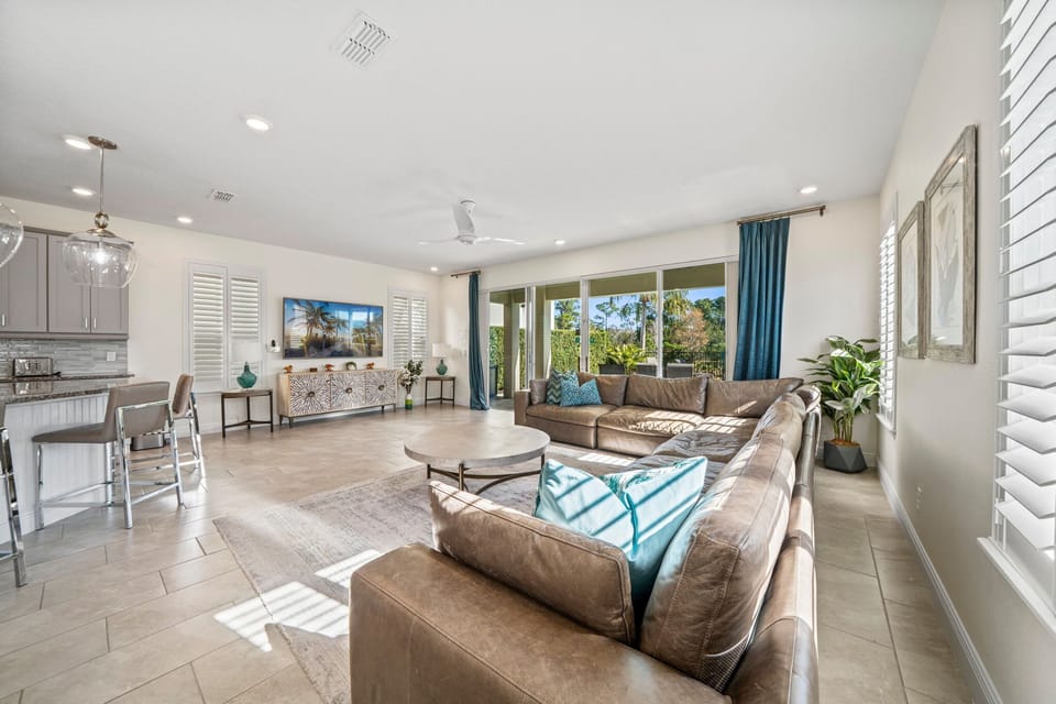 The open living area is the heart of the home, offering comfortable seating and a welcoming space for the whole group to gather. Perfect for relaxing, watching TV, or spending quality time together between adventures.