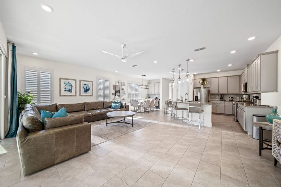 The open living area is the heart of the home, offering comfortable seating and a welcoming space for the whole group to gather. Perfect for relaxing, watching TV, or spending quality time together between adventures.