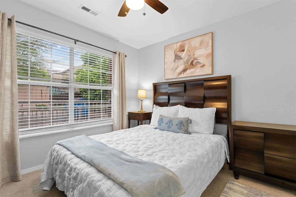 The first bedroom retreat includes a plush queen bed & TV​