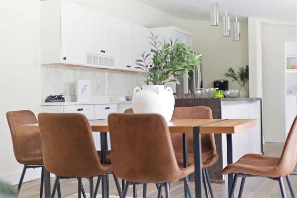 From the dining table, the kitchen and island stay fully in view