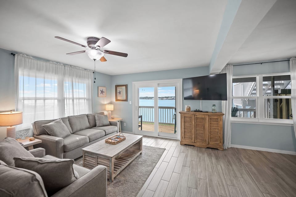 Bright living room with comfortable seating and natural light.