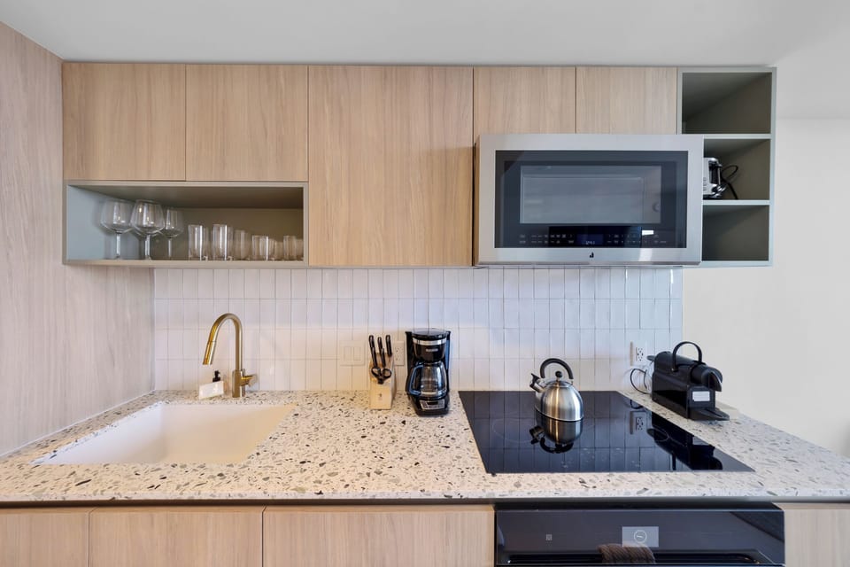 Condo, Balcony, City View | Private kitchen | Toaster, cookware/dishes/utensils, eco-friendly cleaning products