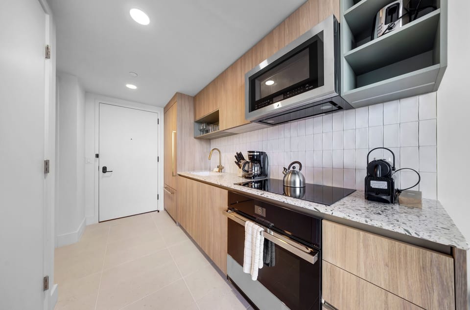 Condo, Balcony, City View | Private kitchen | Toaster, cookware/dishes/utensils, eco-friendly cleaning products