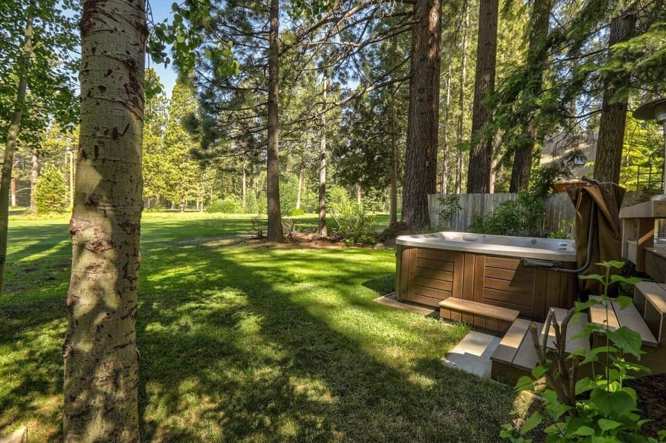 You approach the Hot tub from the Left side of the Master Residence.  
It is great any time of day.  
The deck and garden seating are open to my guests.
But this is an active golf course all summer so don't go wondering out into the fairway....