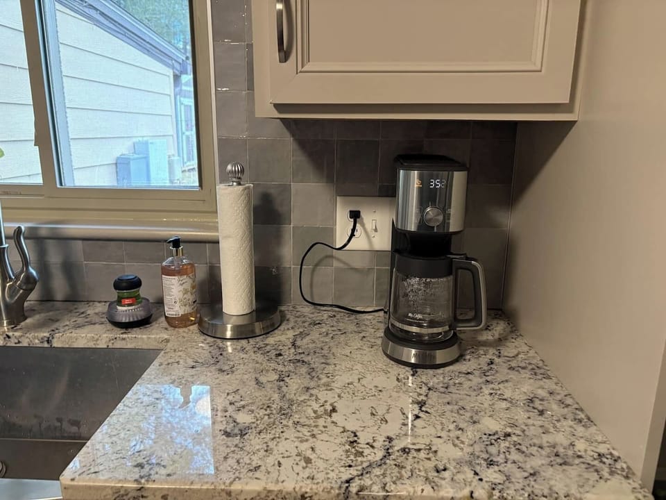coffee maker & coffee, sugar stocked in kitchen