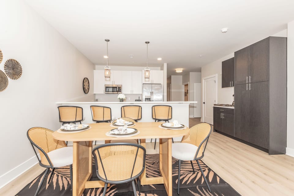 Open dining area flowing into the kitchen with island seating for 4
