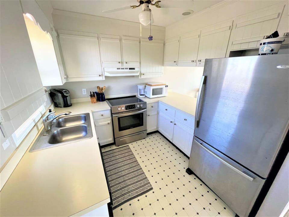 Your fully equipped kitchen has everything you need - stainless steel appliances, granite counters, and plenty of cabinet space for cooking your favorite meals.