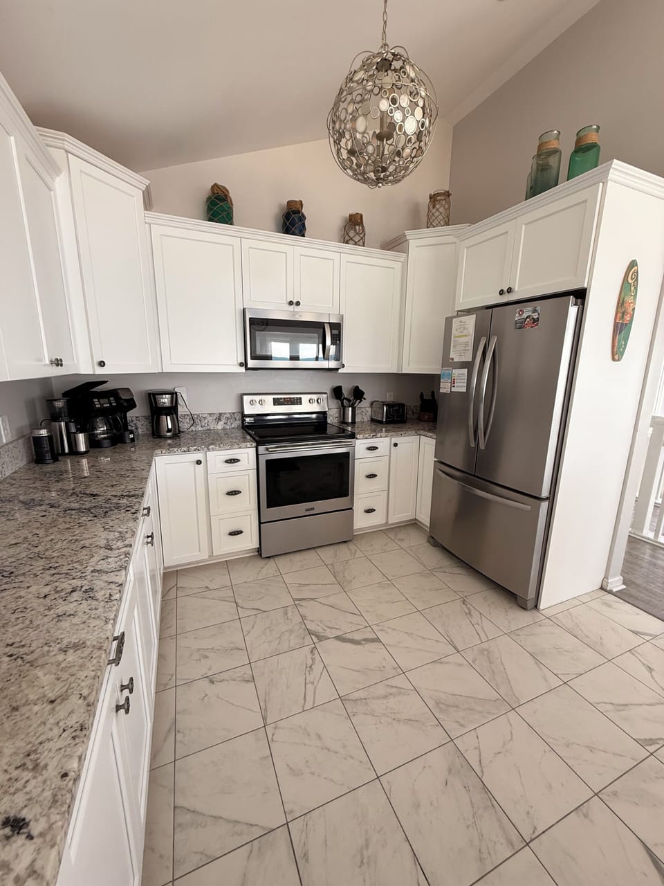 Your fully-equipped kitchen blends modern convenience with elegant design, featuring stainless steel appliances, granite countertops, and ample storage—perfect for preparing memorable meals during your stay.