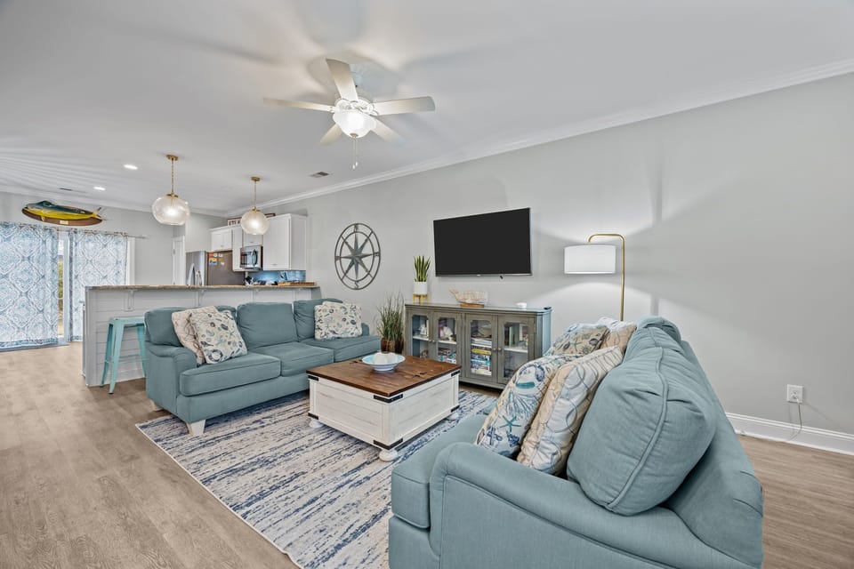Unwind in your bright, coastal living space with plush seating and everything you need for the perfect beach getaway.