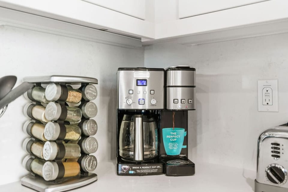 Cuisinart dual-brew coffee maker (drip and single-serve), spice rack, and toaster — your morning routine, covered