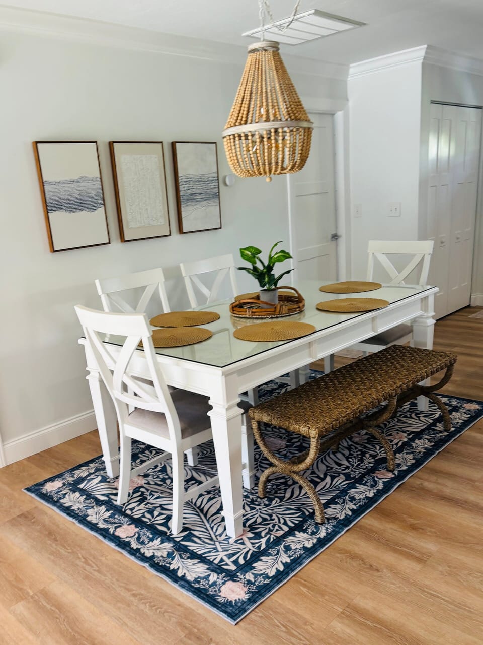 Coastal-style dining area with seating for six