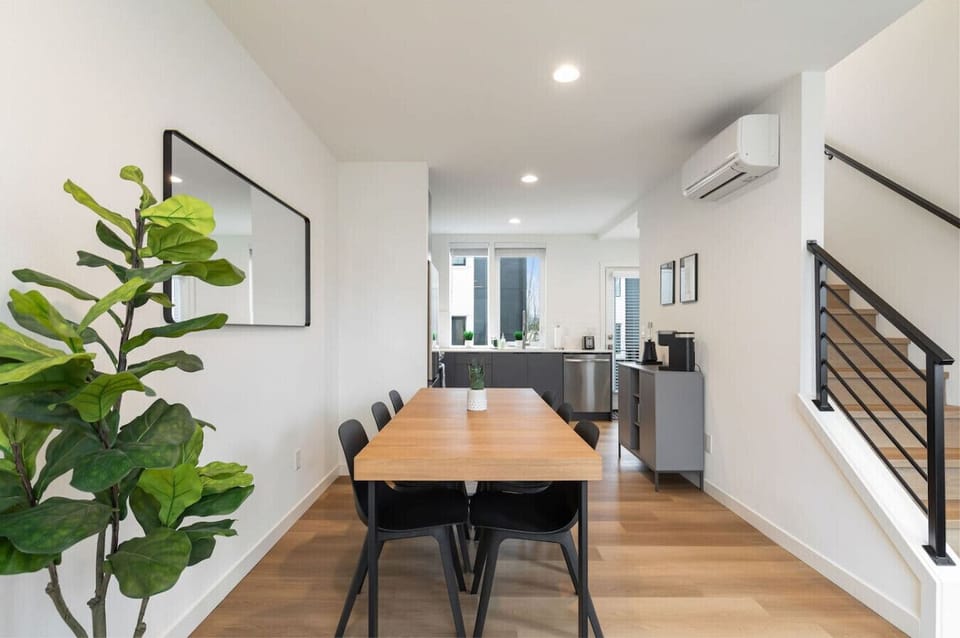 Dining table for six offers a bright spot for breakfast, work sessions, or cozy dinners in.