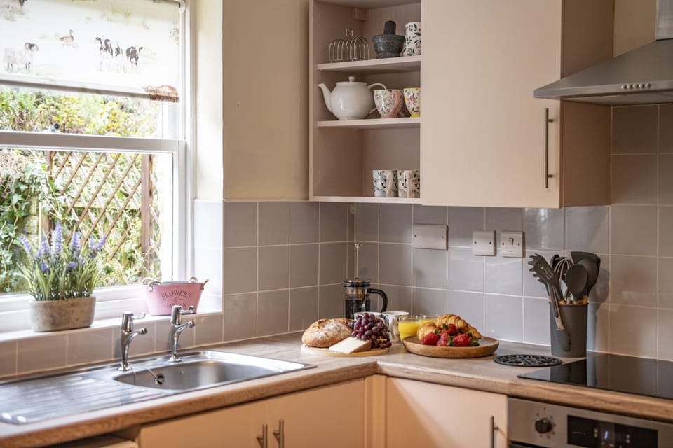 Ground floor: Well equipped kitchen overlooked the terrace patio