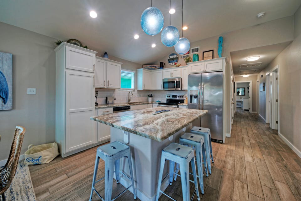 Fully equipped kitchen with spacious island seating—perfect for cooking, gathering, and casual meals.