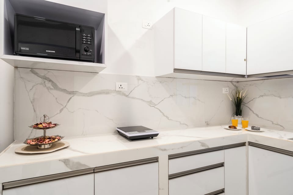Apartment, 2 Bedrooms, Balcony | Private kitchen | Electric kettle, dining tables