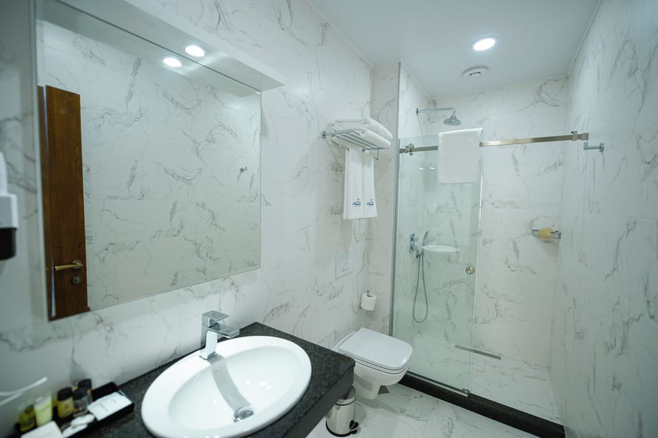 Shower, free toiletries, hair dryer, slippers