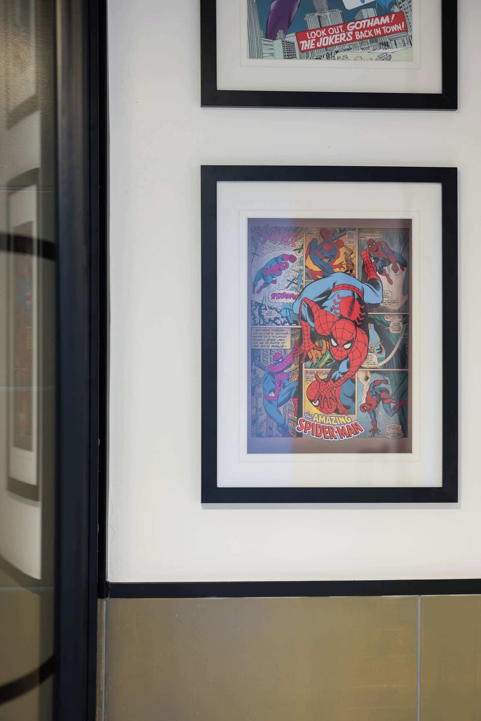 A framed artwork displayed on a wall. The piece adds color and personality to the interior.