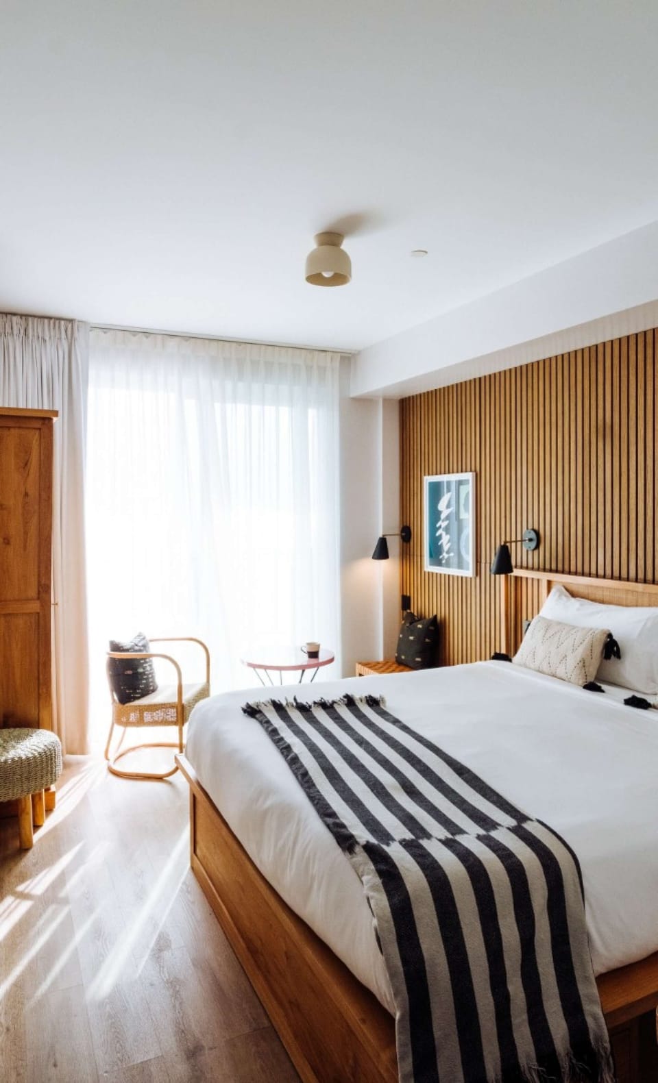 Deluxe King Ocean with Terrace - Spacious King bed with striped throw and ocean terrace