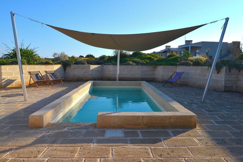 Swimming Pool, Composite Material, Shade, Flagstone, Concrete, Outdoor Furniture, Tile, Landscaping, Backyard, Courtyard