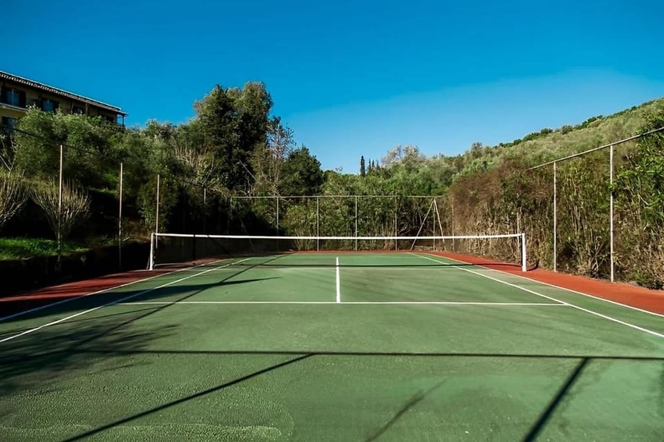 Shared tennis court available for guests to enjoy.