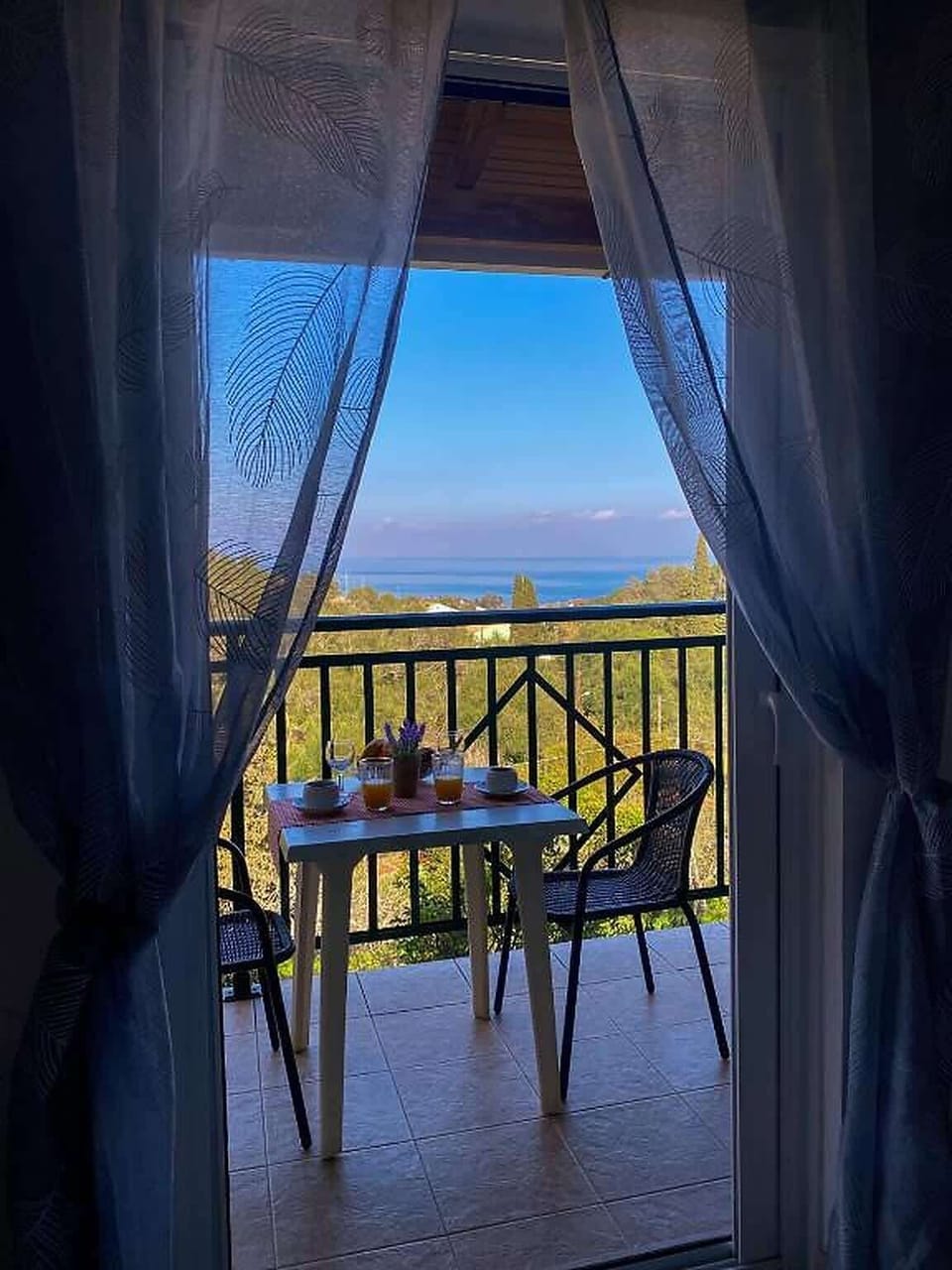 Private balcony entrance with peaceful sea views.