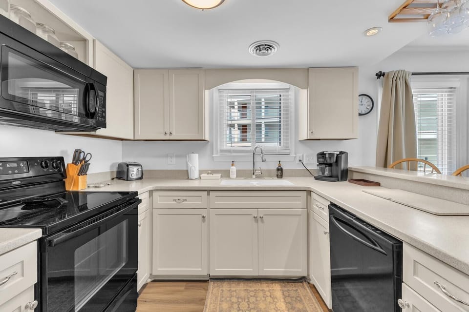 Your fully equipped kitchen awaits with modern appliances and ample counter space for preparing memorable meals during your stay.
